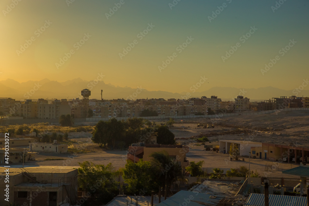 the streets of the city of Hurghada, located on the shores of the Red Sea, are illuminated by the last rays of the setting sun
