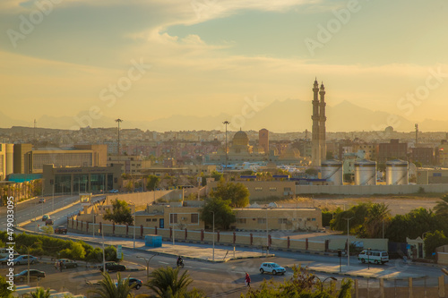 the streets of the city of Hurghada, located on the shores of the Red Sea, are illuminated by the last rays of the setting sun