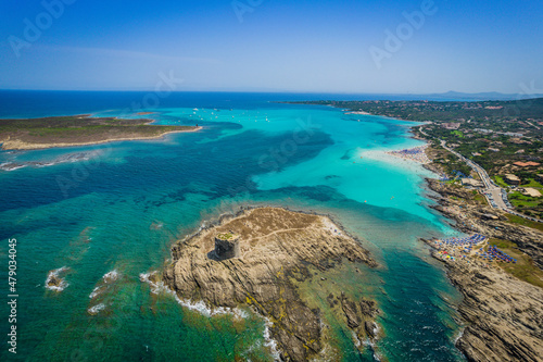 Aerial view of nuraghe in a island in Stintino, La Pelosa beach in Mediterranean sea. The nuraghe or also nurhag in English, is the main type of ancient megalithic edifice found in Sardinia.