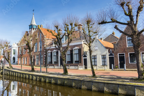Historic town hall and old houses at the canal in Balk, Netherlands