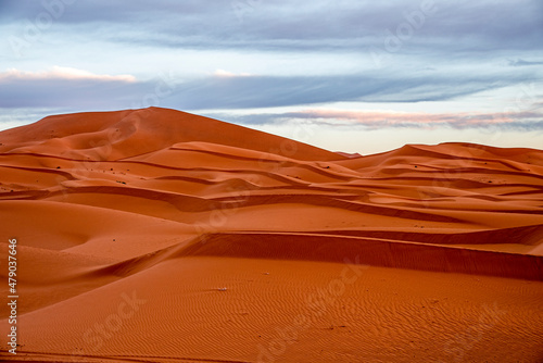 Beautiful view of sand dunes in sahara desert against cloudy sky, Sand dunes with waves pattern in desert