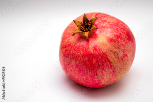 Fresh pomegranate on a white background