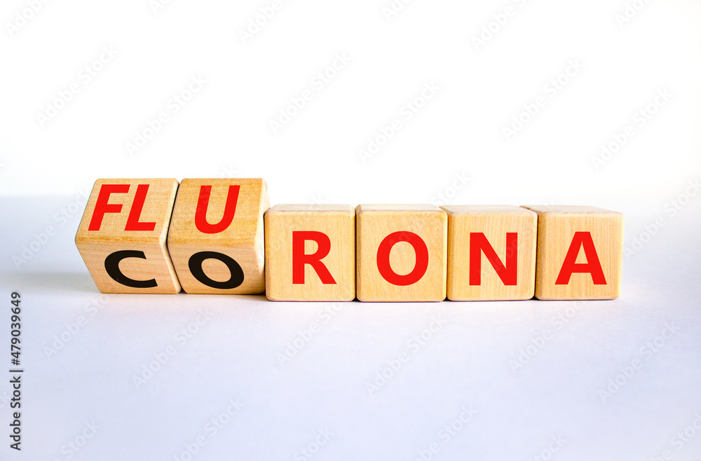 Covid-19 corona and flu flurona symbol. Turned cubes and changed the word corona to flurona. Beautiful orange table, orange background. Medical, covid-19 corona and flu flurona concept. Copy space. Covid-19 corona and flu flurona symbol. Turned cubes and changed the word corona to flurona. Beautiful orange table, orange background. Medical, covid-19 corona and flu flurona concept. Copy space.