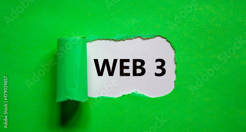 WEB 3 symbol. Concept words WEB 3 appearing behind torn green paper. Beautiful white and green background, copy space. Business, technology and WEB 3.0 or web 3 concept.