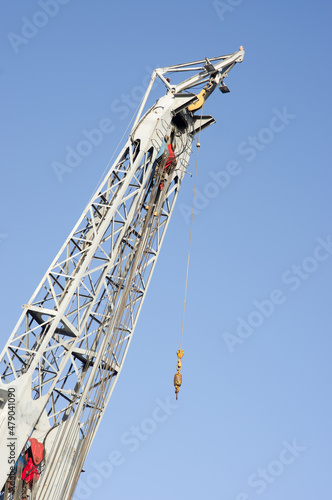 Closeup of a large grey tower crane