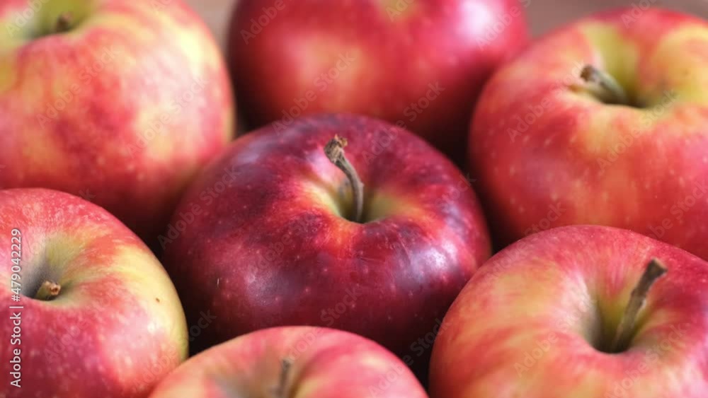 Close up of fresh red apples in the rotate basket Close up of fresh red apples in the rotate basket