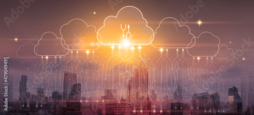 Cloud computing and download concept. Double exposure smart city.Abstract glowing clouds hologram on warm tone city background.