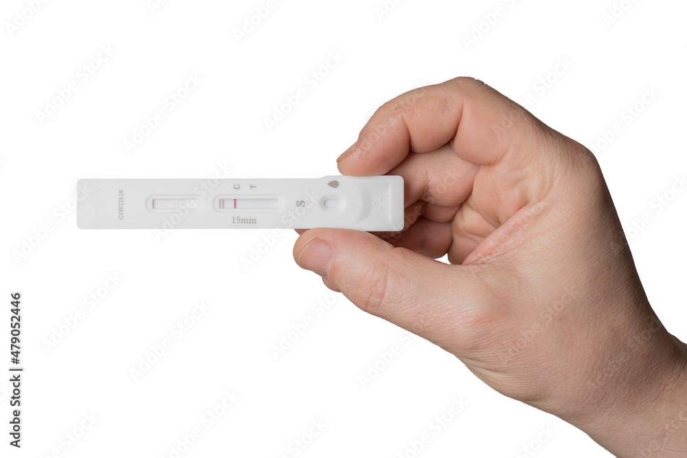 Man hold a negative antigen rapid test device for coronavirus covid-19 on a white background Man hold a negative antigen rapid test device for coronavirus covid-19 on a white background