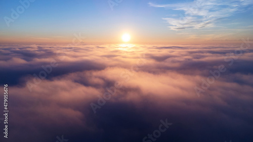 View Of The Sunset Above The Clouds
