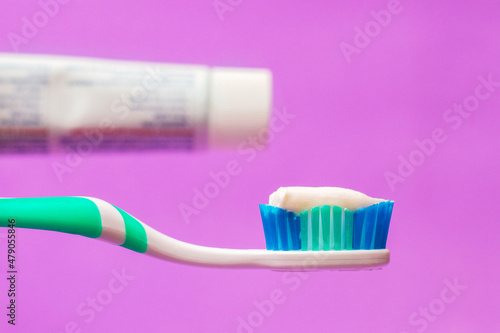 Applying toothpaste on a toothbrush. Dental care