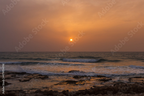 foggy sunset on the beach near haifa