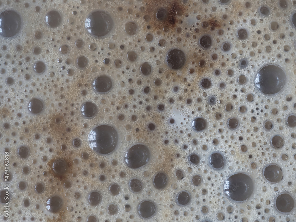 Macro photo of the surface of a cup of coffee