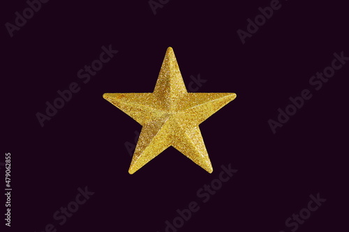 golden star in dark purple background