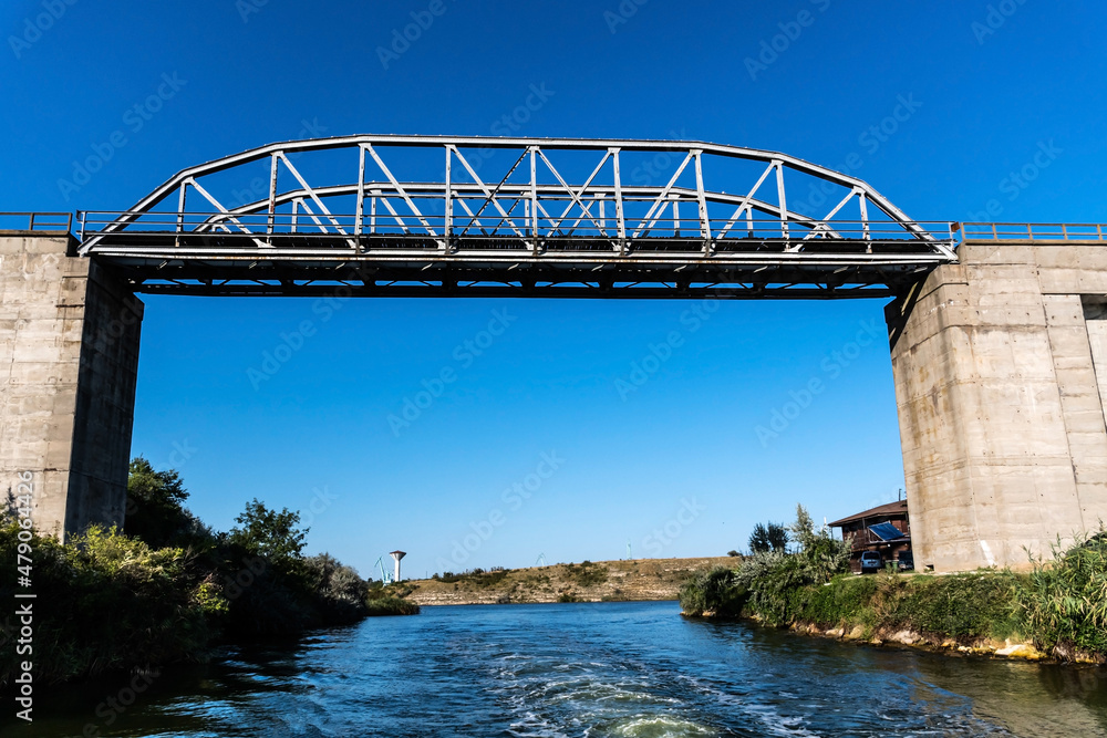 Fototapeta premium Landscape with the bridge at the entrance in the Limanu lake area, near the harbor. Constanta, Romania.