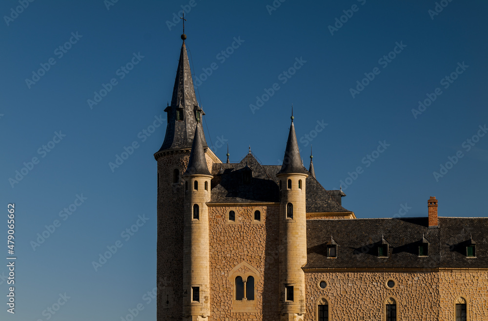 Detail of Alcazar castle in Segovia, Spain, against blue sky