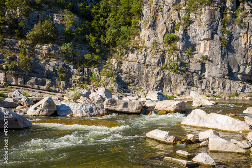 The Gorges de lArdeche and the pebble beach in Europe, France, Ardeche, in summer, on a sunny day.