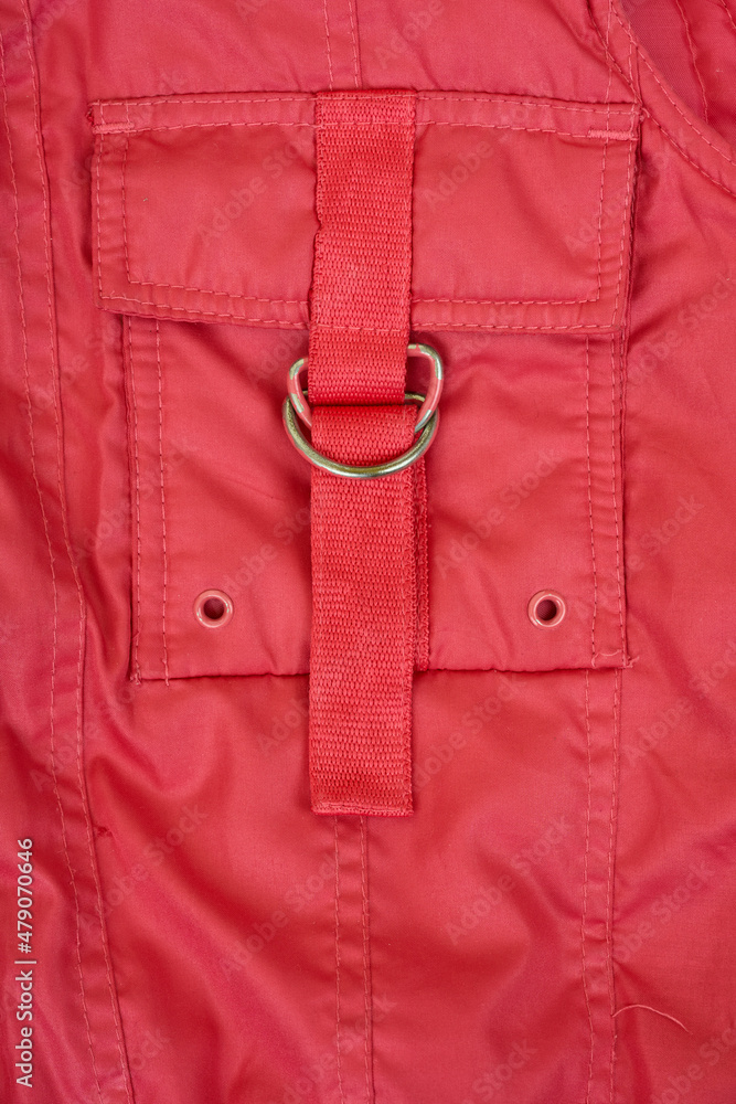 Red pocket in the nylon jacket close up. Red pocket in the nylon jacket close up.