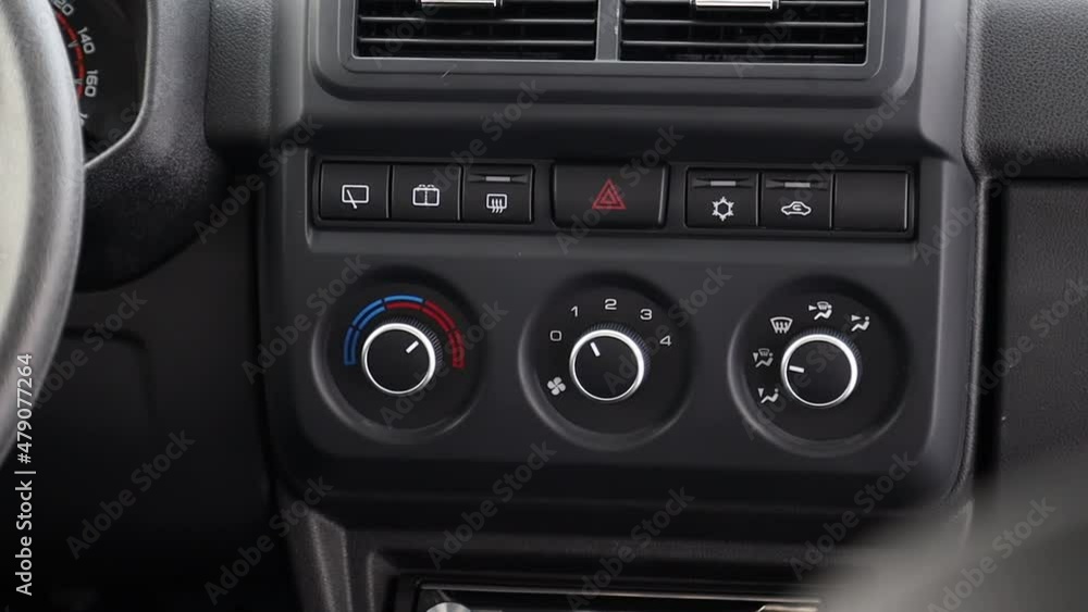 a man presses the button to wash the windshield a man presses the button to wash the windshield
