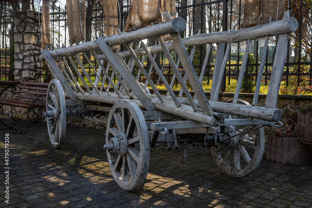 Old horse-drawn cart. In the village yard. Transport