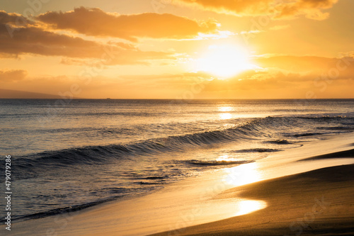 Warm calm waves greet this beautiful beach at sunset in Maui Hawaii © ricardoreitmeyer