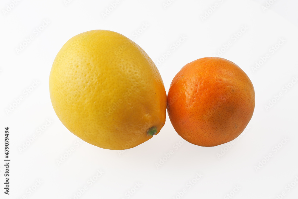 Lemon and tangerine on an isolated white background. Lemon and tangerine on an isolated white background.