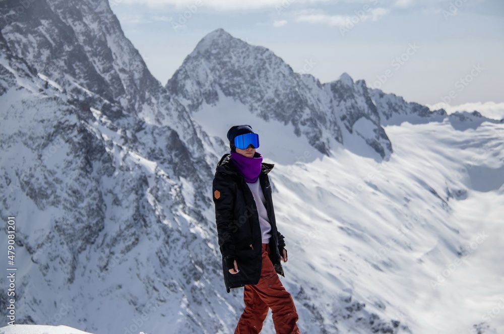 Portrait of a girl on top of a snowy mountain