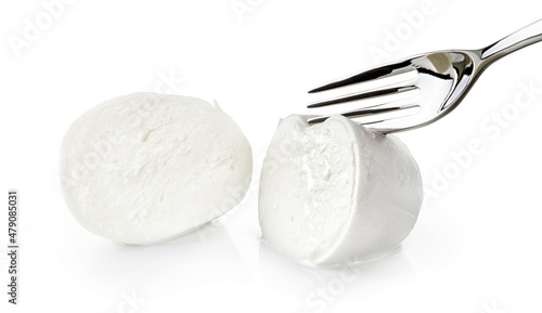 Fresh buffalo mozzarella with fork isolated on white background, closeup.. photo
