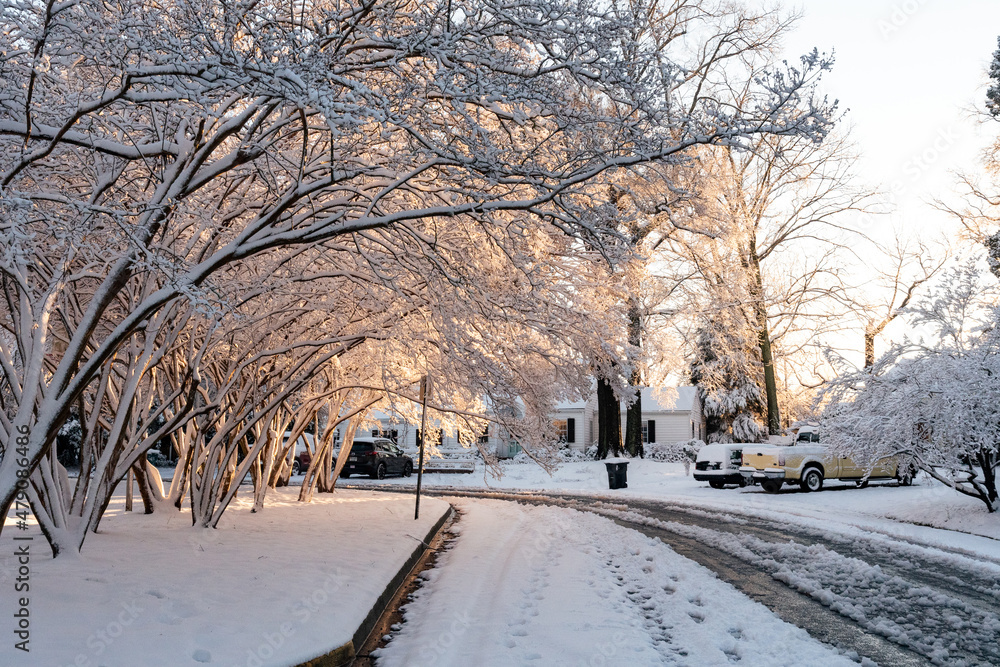 Richmond, Virginia, - 1/4/2022 - The first snowfall in the suburbs of Richmond with snow covered trees, snowy roads and icicles. Richmond, Virginia, - 1/4/2022 - The first snowfall in the suburbs of Richmond with snow covered trees, snowy roads and icicles.