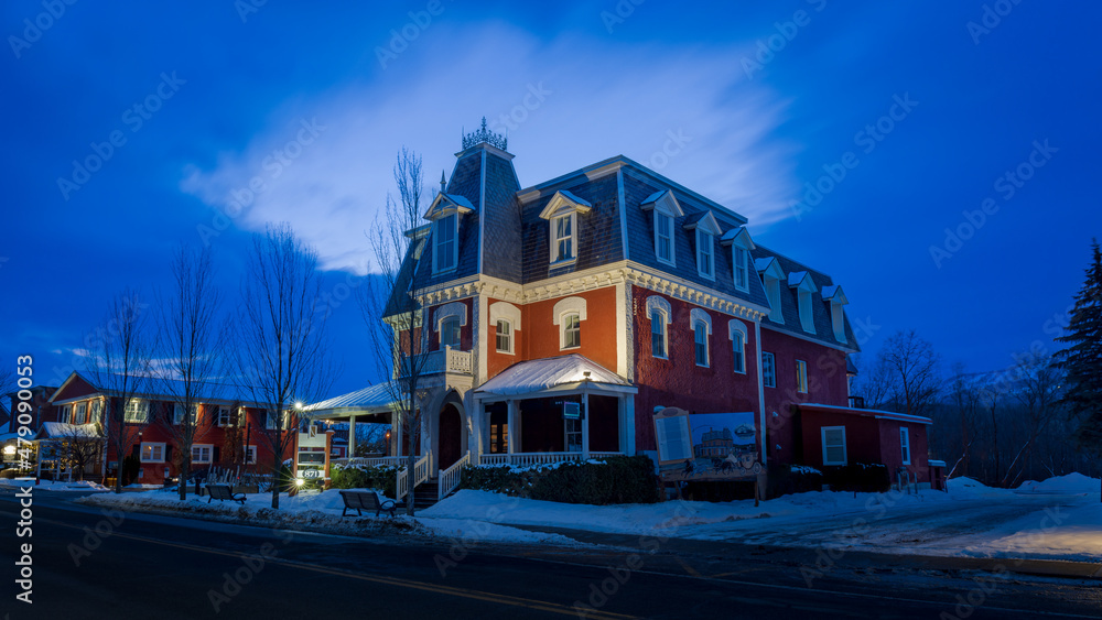 Fototapeta premium the main street of the city of Bromont with the Ski Mountain in the background. Eastern Townships, Quebec, Canada.