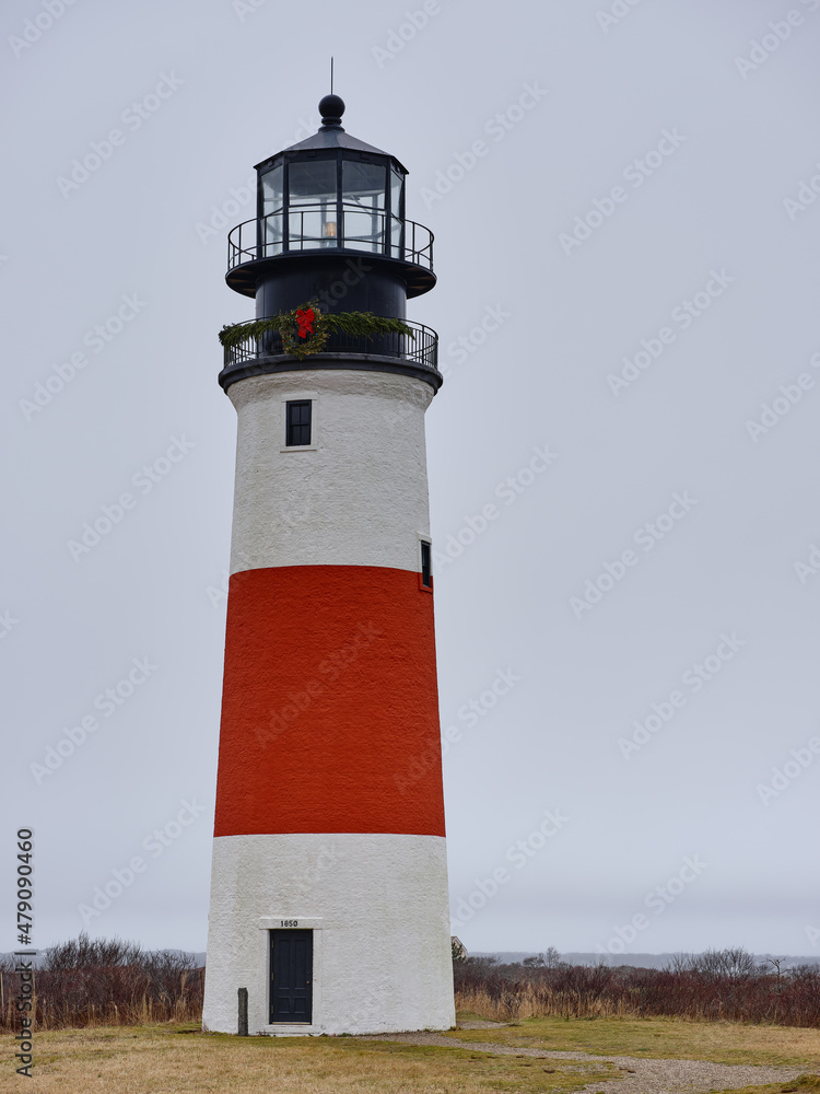 The Sankaty  Head Coast Guard Lighthouse on the island of Nantucket on a drizzly and foggy day