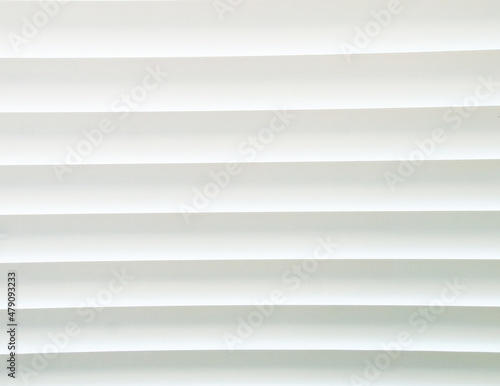 Texture of horizontal closed white blinds. Background.