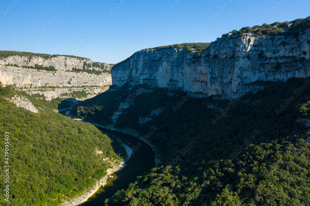 The shadow of the cliffs above the Gorges de lArdeche in Europe, France, Ardeche, in summer, on a sunny day.