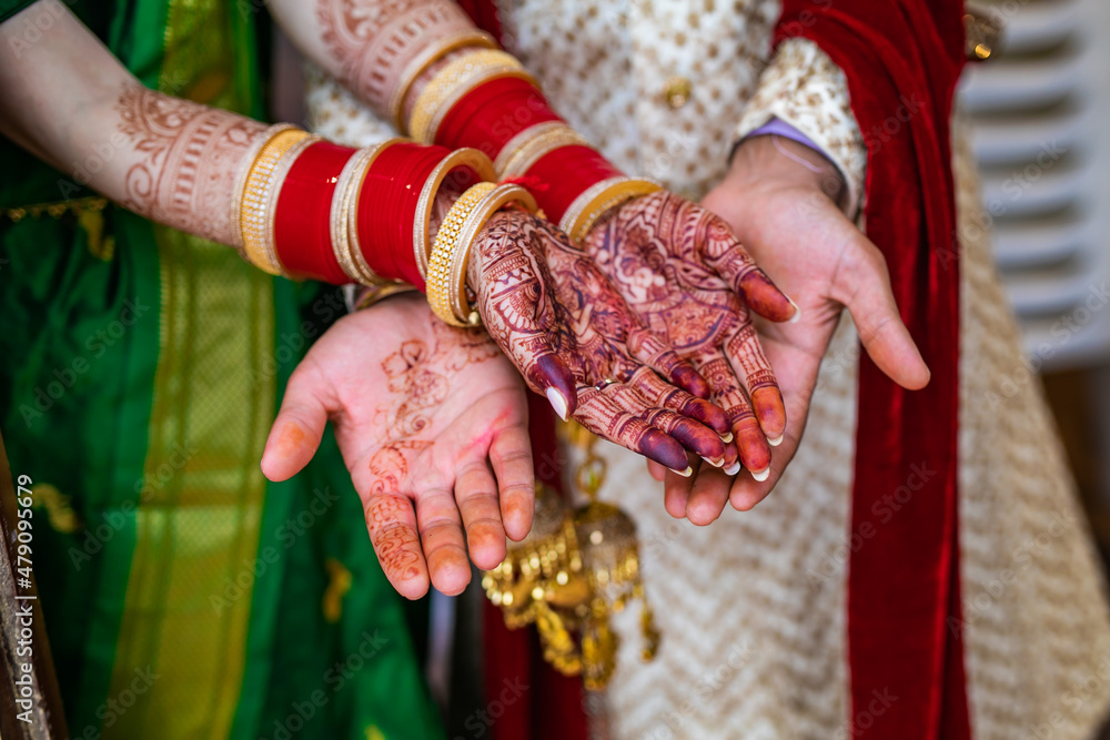 Indian married couple's holding hands close up