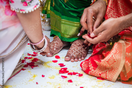 Indian Hindu wedding ceremony ritual items, hands and feet close up