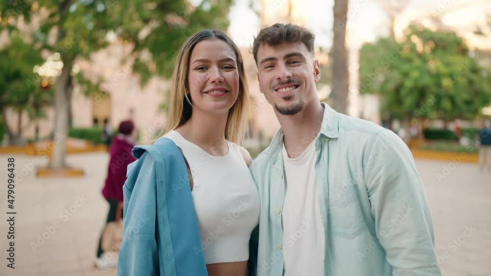 Young couple smiling confident hugging each other standing at street Young couple smiling confident hugging each other standing at street