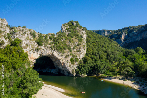 The Pont dArc in the Gorges de lArdeche in the middle of the green countryside in Europe  France  Ardeche  in summer  on a sunny day.