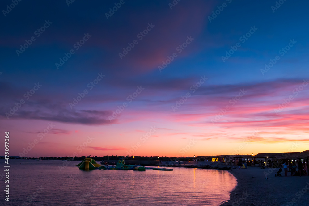 Sea and beach on beautiful blue and purple sunset
