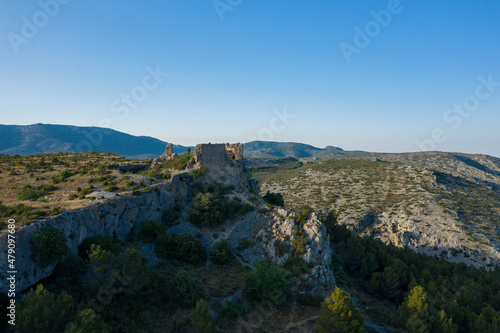 The Chateau de Opoul Perillos in the arid countryside of the south of Europe, France, Occitanie, the Pyrenees Orientales, in the summer on a sunny day.