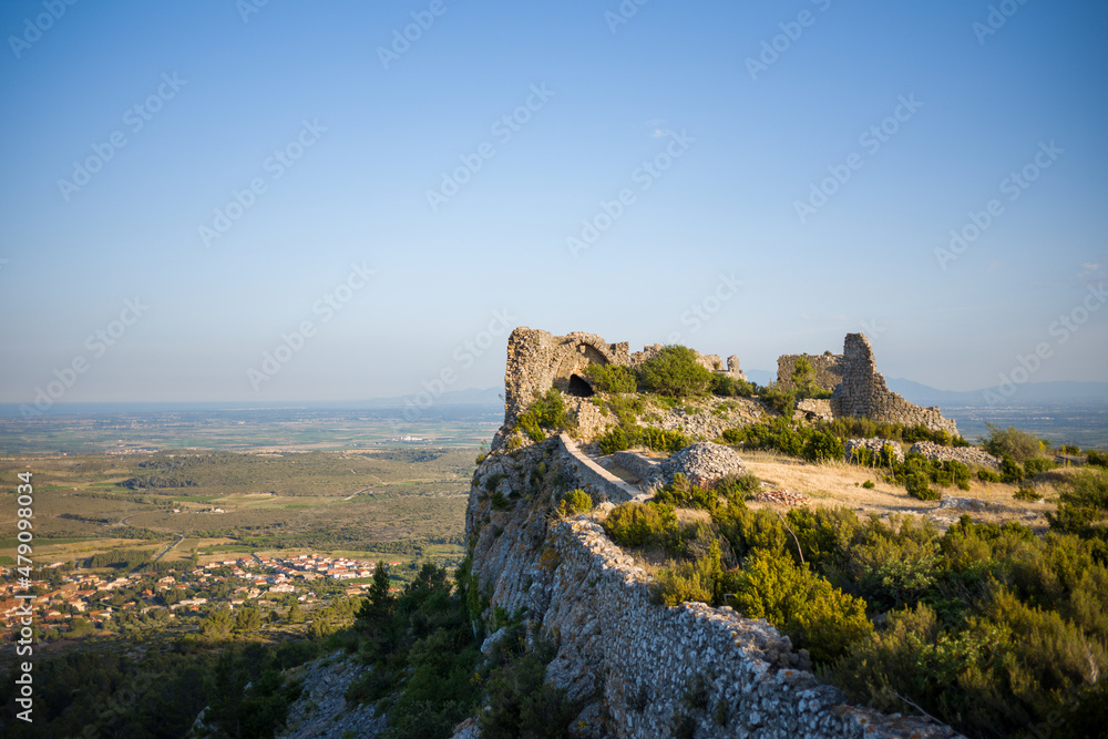 The Chateau de Opoul Perillos on its rock in Europe, France, Occitanie, the Pyrenees Orientales, in summer, on a sunny day.