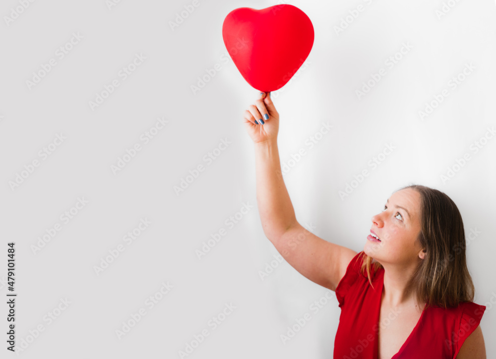 Young white woman holding red heart Young white woman holding red heart