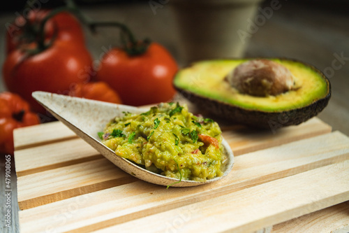 I LOVE FOOD SERIES. Latin American food on a wooden table with fresh, healthy and natural ingredients, perfect for a dinner. guacamole sauce, avocado sauce Latin American food