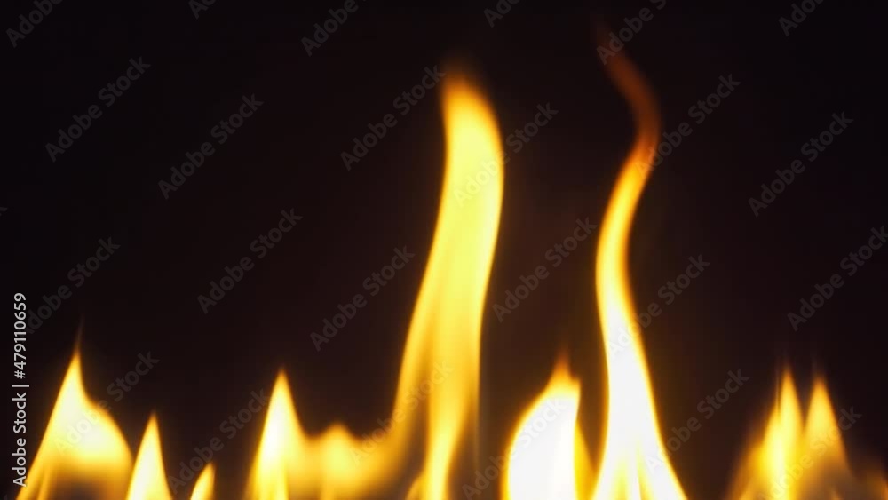 4k raw slow motion 60 fps video of a fire line with a beautiful dancing flames on a black background. 4k raw slow motion 60 fps video of a fire line with a beautiful dancing flames on a black background.