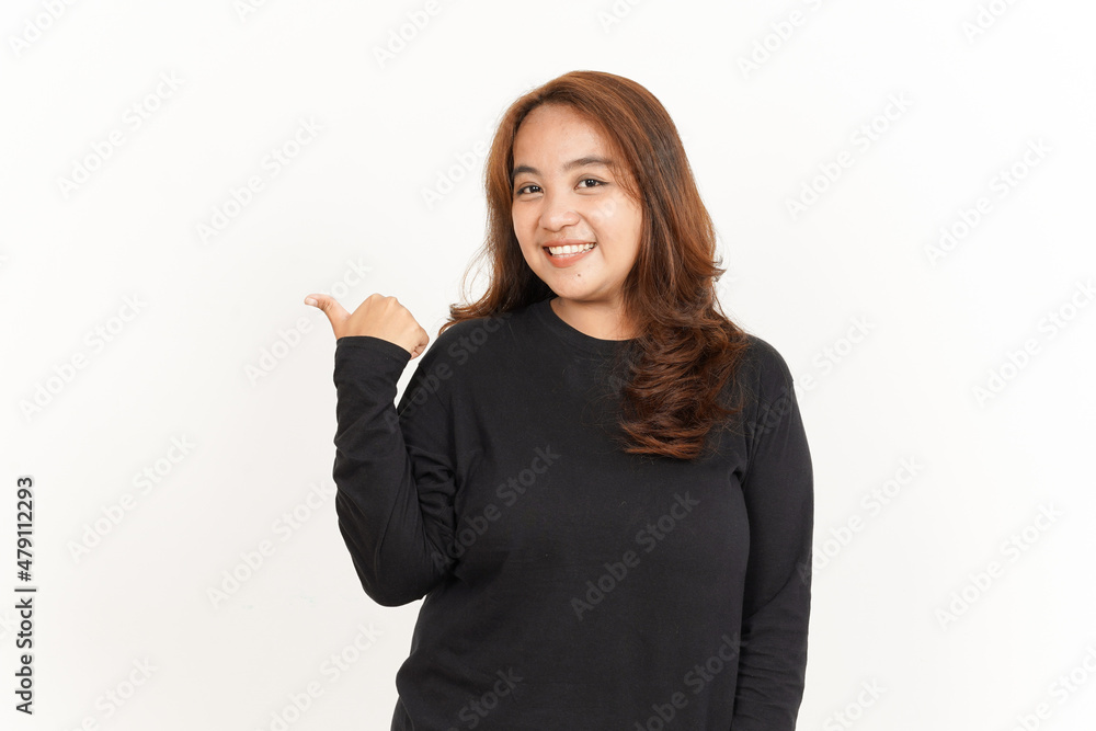 Pointing to Product Using Thumb Of Beautiful Asian Woman Wearing Black Shirt Isolated On White Pointing to Product Using Thumb Of Beautiful Asian Woman Wearing Black Shirt Isolated On White