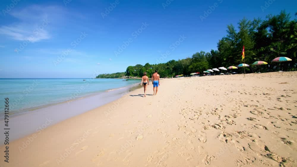 Tourist crowd of people at tropical Beach with blue sky in Phuket, Thailand, Beautiful Phuket beach is famous tourist destination at Andaman sea. Top view happy people play on the beach Tourist crowd of people at tropical Beach with blue sky in Phuket, Thailand, Beautiful Phuket beach is famous tourist destination at Andaman sea. Top view happy people play on the beach