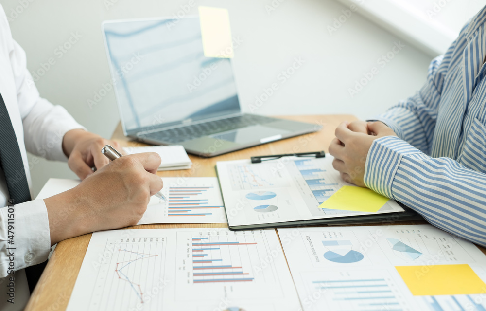 Two business leaders talk about charts, financial graphs showing results are analyzing and calculating planning strategies, business success building processes Two business leaders talk about charts, financial graphs showing results are analyzing and calculating planning strategies, business success building processes