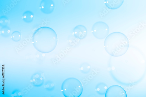 Beautiful Transparent Blue Soap Bubbles on White Background 