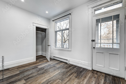 Empty beautiful old style modern renovated apartment in 2 floors Canadian house with nice equipped contemporary kitchen with appliances  stove  fridge  washer and dryer  new bathroom and powder room