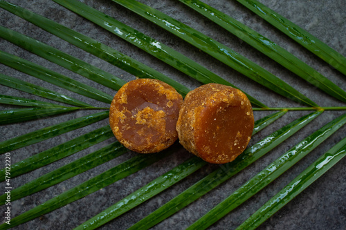  brown sugar with palm leaf base and blurred background photo