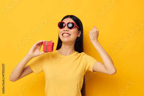Portrait Asian beautiful young woman with gift boxes in hands fun posing Monochrome shot