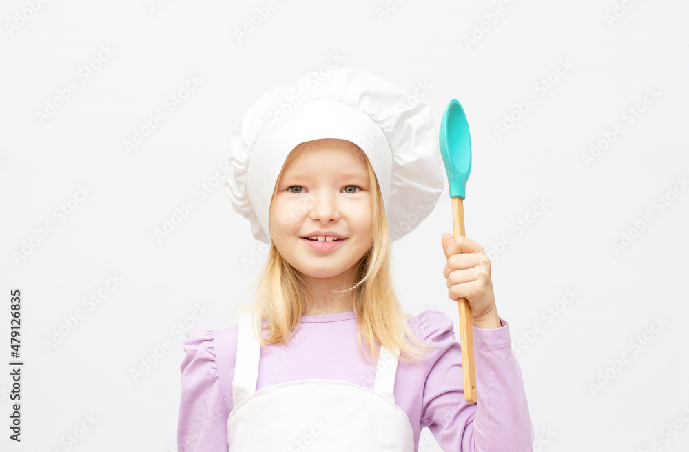 Beautiful little girl in chef uniform isolated on white Beautiful little girl in chef uniform isolated on white